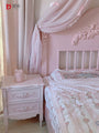 Aesthetic European princess-style pink and white carved wooden bedside table